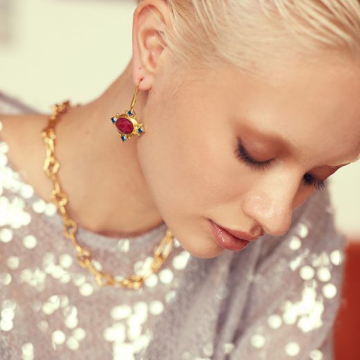 model wearing ruby earrings